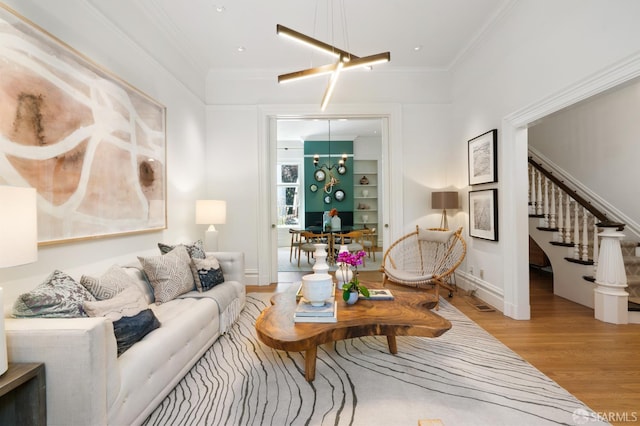49 Hill St, San Francisco, CA 94110 - living area featuring light wood-style floors, a chandelier, stairway, and crown molding