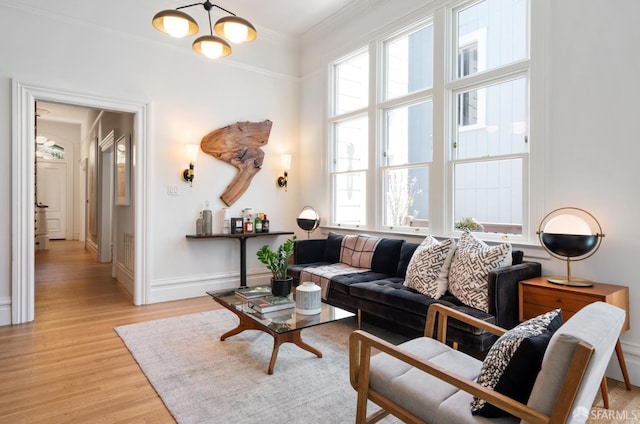 49 Hill St, San Francisco, CA 94110 - living area featuring a chandelier, light wood-type flooring, and ornamental molding