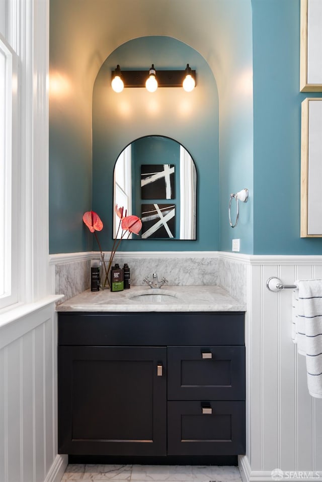 49 Hill St, San Francisco, CA 94110 - bathroom with vanity, wainscoting, and marble look tiles