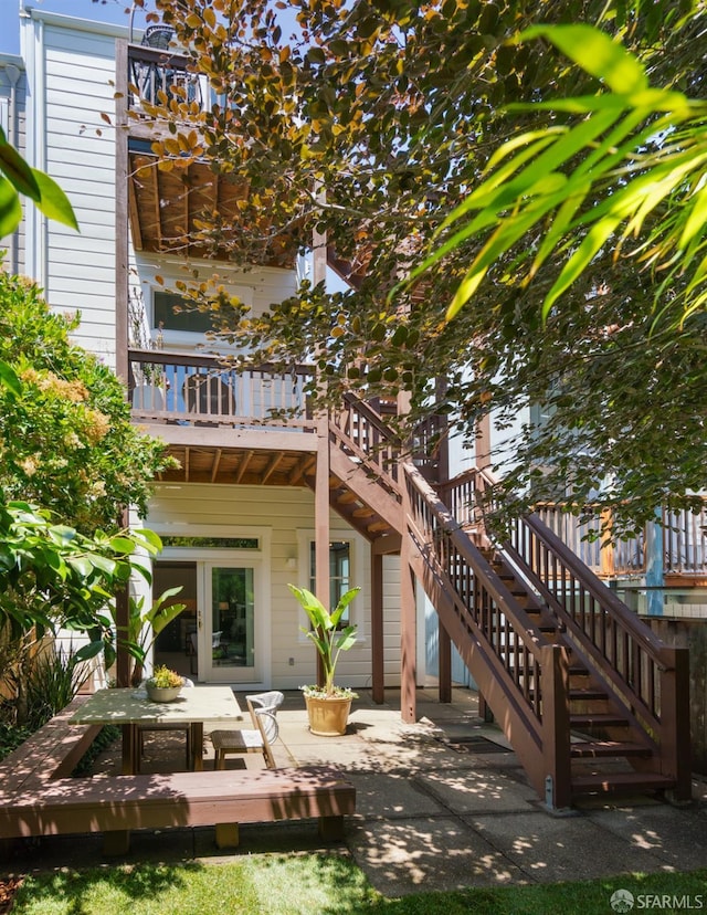 49 Hill St, San Francisco, CA 94110 - back of house with stairway, a wooden deck, and a patio