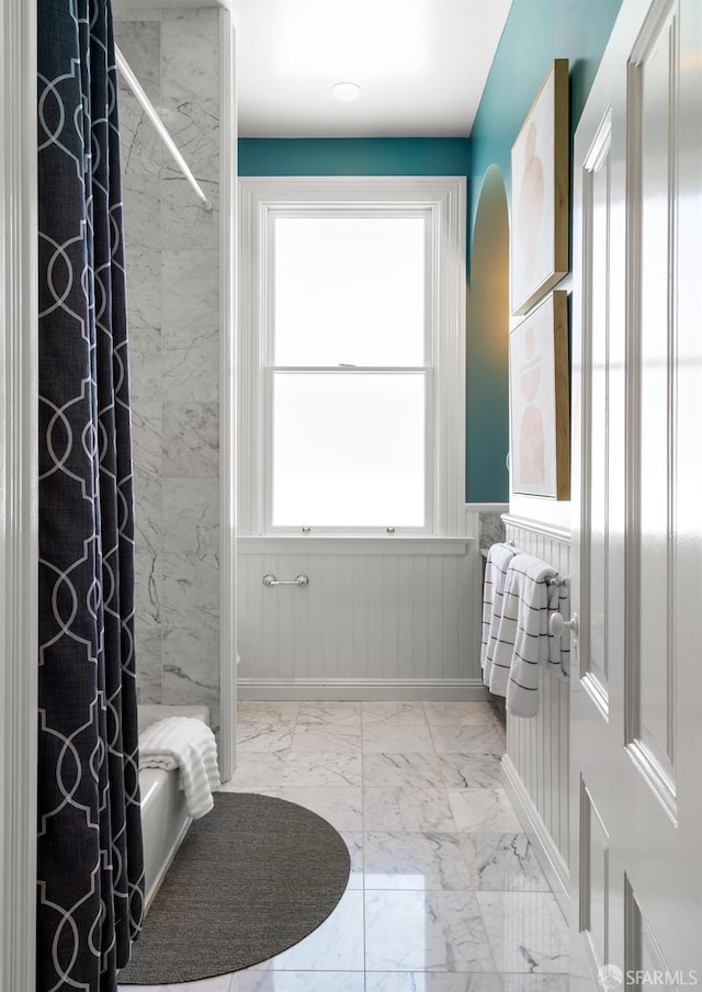49 Hill St, San Francisco, CA 94110 - full bath with marble look tile flooring, wainscoting, and shower / tub combo with curtain
