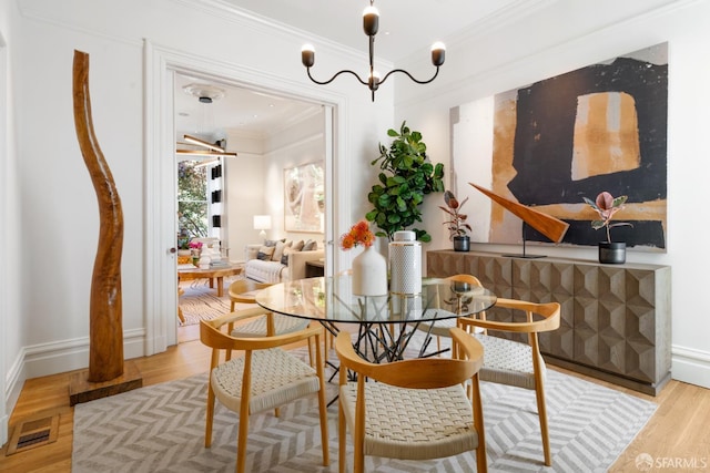 49 Hill St, San Francisco, CA 94110 - dining area featuring ornamental molding and wood finished floors