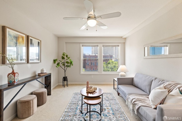 carpeted living room featuring ceiling fan