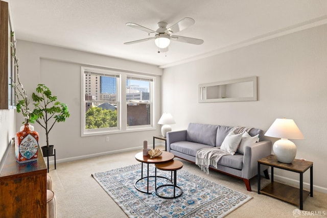 living room featuring ceiling fan and light colored carpet