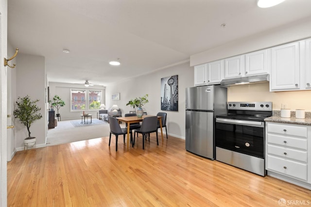 kitchen with ceiling fan, stainless steel appliances, light wood-type flooring, and white cabinetry