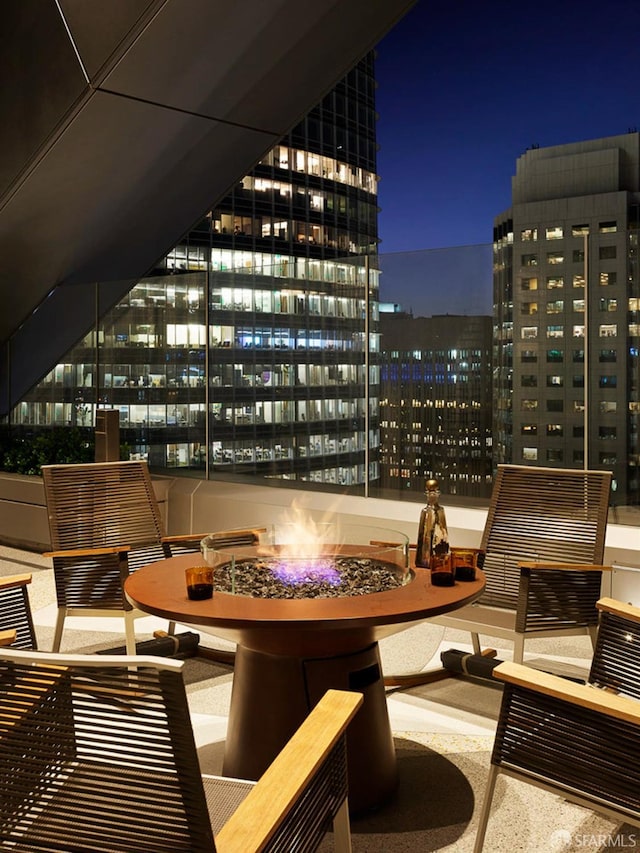 balcony at night with a fire pit