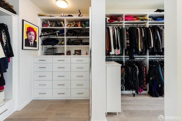 spacious closet featuring light wood-type flooring