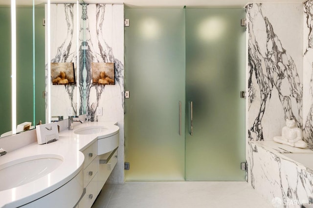 bathroom featuring tile patterned flooring, vanity, and separate shower and tub