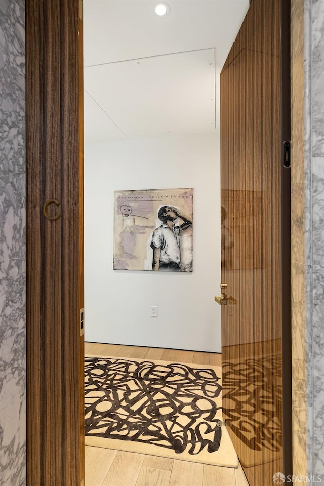 hallway featuring hardwood / wood-style flooring