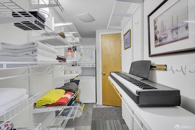 interior space with stacked washer and dryer and light countertops