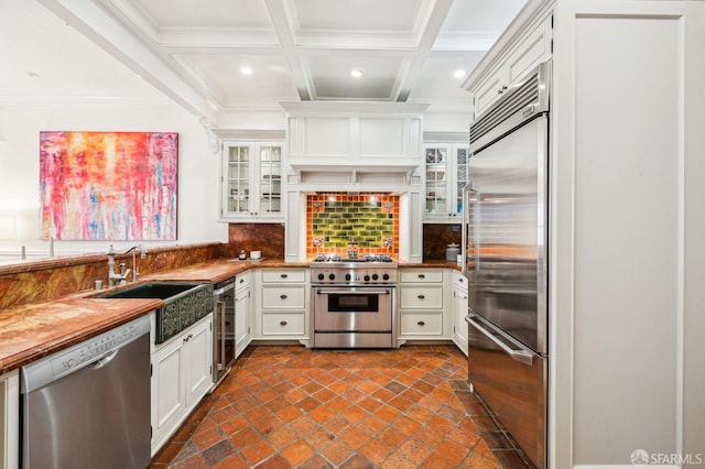 kitchen featuring sink, wine cooler, white cabinets, backsplash, and high end appliances