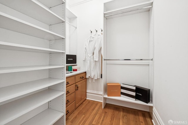 spacious closet featuring light wood-type flooring