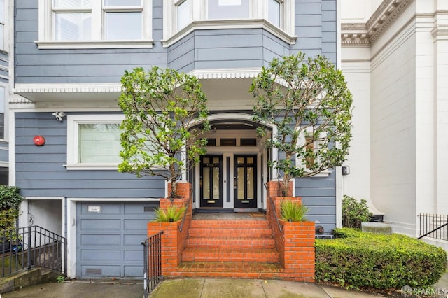 view of exterior entry featuring a garage