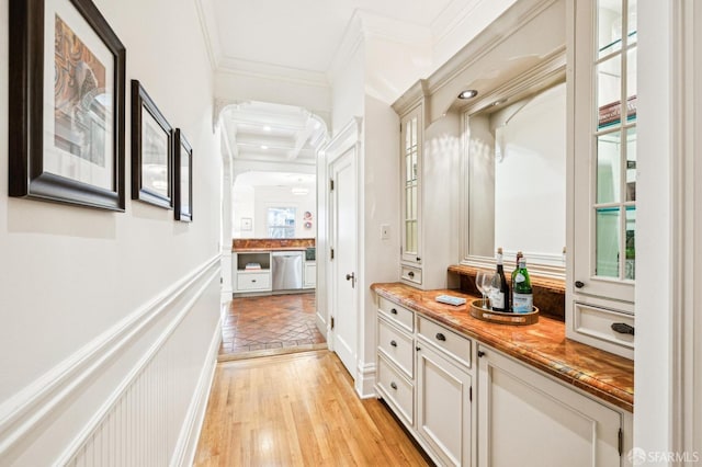 mudroom featuring ornamental molding and light hardwood / wood-style flooring