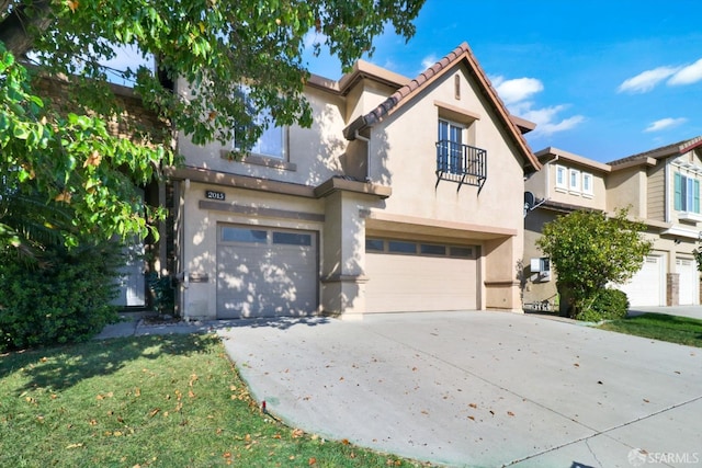 view of front facade with a garage, concrete driveway, a balcony, a tile roof, and stucco siding