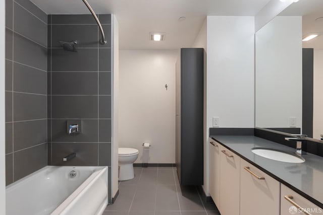 full bathroom featuring toilet, vanity, baseboards, shower / bathing tub combination, and tile patterned floors