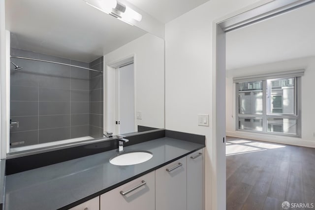 full bath with wood finished floors and vanity