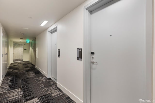 corridor featuring baseboards