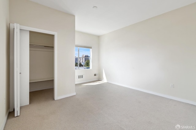 1600 Webster St Unit 409, San Francisco, CA 94115 - unfurnished bedroom with a closet, carpet, visible vents, a spacious closet, and baseboards