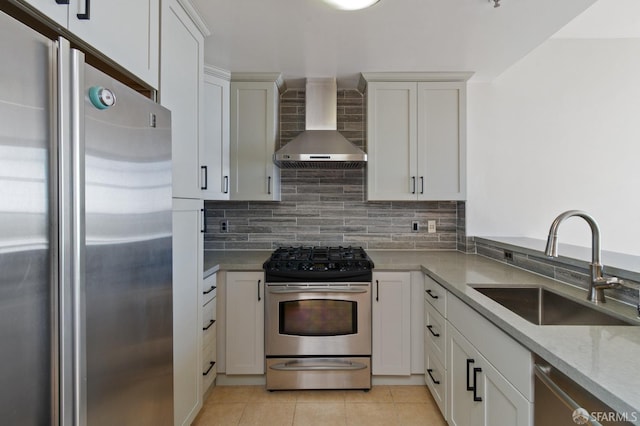 1600 Webster St Unit 409, San Francisco, CA 94115 - kitchen featuring light tile patterned floors, a sink, decorative backsplash, wall chimney range hood, and stainless steel appliances