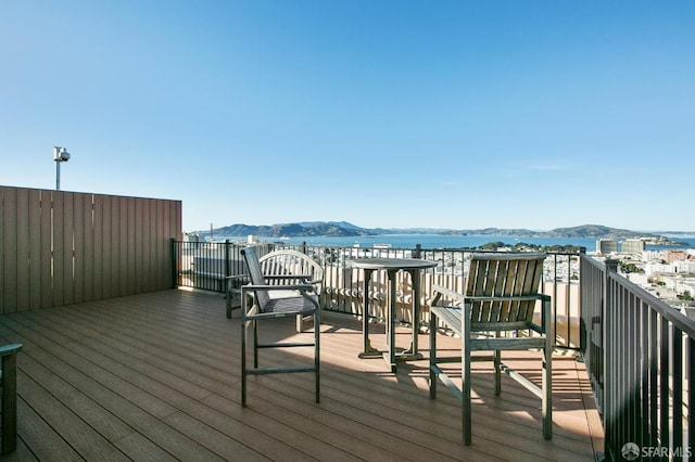 wooden deck with a mountain view