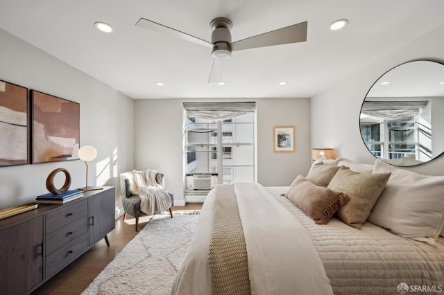 bedroom featuring dark hardwood / wood-style floors and ceiling fan