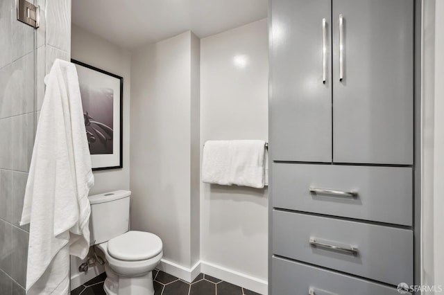 bathroom featuring tile patterned floors and toilet