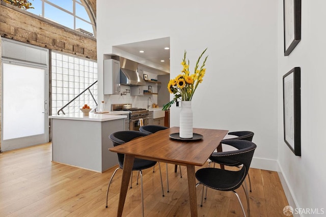 1 Rausch St Unit A, San Francisco, CA 94103 - dining space featuring light wood-type flooring, a high ceiling, and recessed lighting