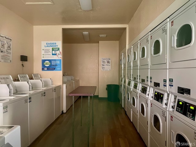 laundry room with dark wood-type flooring, stacked washer / drying machine, and separate washer and dryer