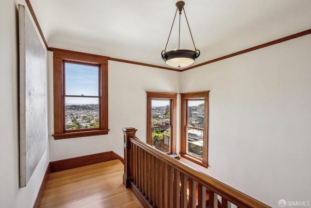 4020 20th St, San Francisco, CA 94114 - hall featuring an upstairs landing, light wood-style flooring, baseboards, and crown molding