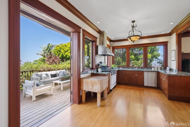 4020 20th St, San Francisco, CA 94114 - kitchen with stainless steel dishwasher, gas range oven, light wood-type flooring, exhaust hood, and crown molding