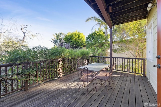 deck featuring outdoor dining area