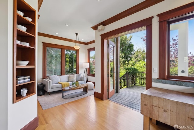 4020 20th St, San Francisco, CA 94114 - living room featuring light wood-type flooring, crown molding, baseboards, and recessed lighting