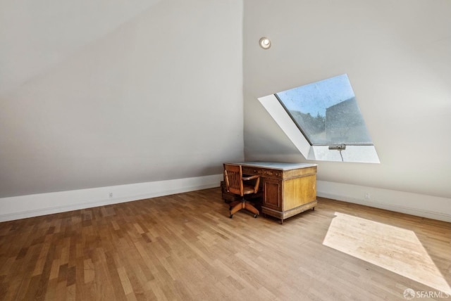 4020 20th St, San Francisco, CA 94114 - additional living space with a skylight, light wood-style floors, and baseboards
