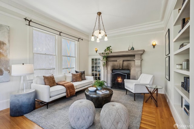 4020 20th St, San Francisco, CA 94114 - living area with wood finished floors, crown molding, a tiled fireplace, built in features, and baseboards