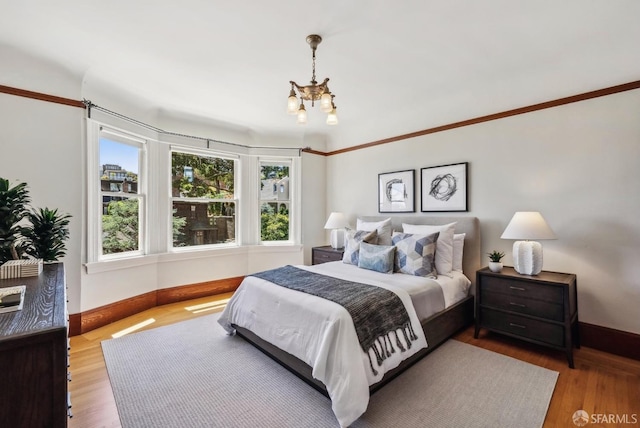 4020 20th St, San Francisco, CA 94114 - bedroom featuring a chandelier, baseboards, and wood finished floors