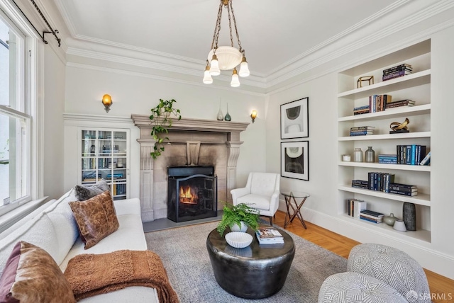 4020 20th St, San Francisco, CA 94114 - living area with ornamental molding, a tiled fireplace, built in shelves, wood finished floors, and baseboards