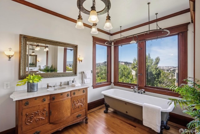 4020 20th St, San Francisco, CA 94114 - full bathroom featuring baseboards, a freestanding bath, vanity, wood finished floors, and a chandelier