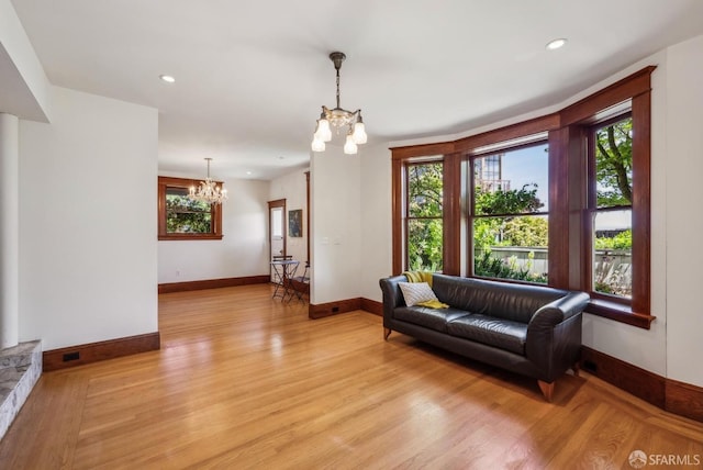 4020 20th St, San Francisco, CA 94114 - living room with a chandelier, light wood-style flooring, baseboards, and recessed lighting