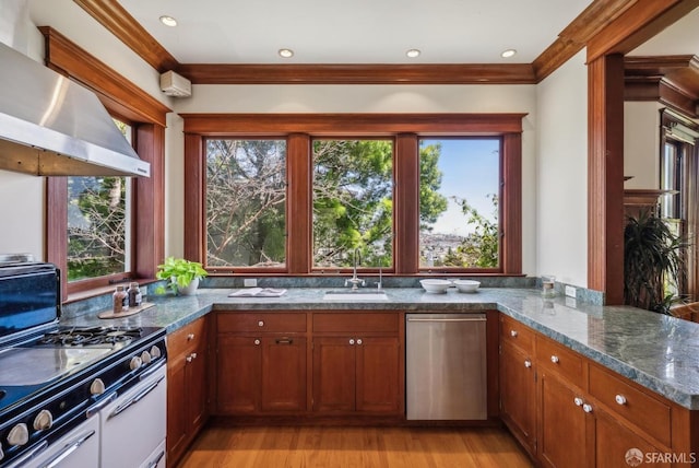4020 20th St, San Francisco, CA 94114 - kitchen with stainless steel dishwasher, a sink, dark stone countertops, light wood-style flooring, and extractor fan