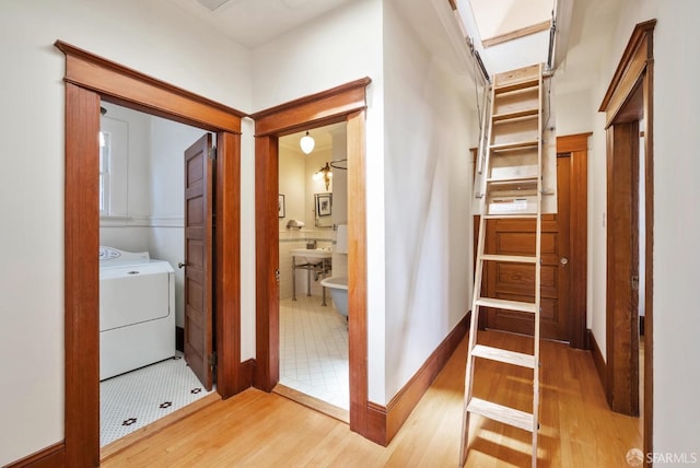 4020 20th St, San Francisco, CA 94114 - corridor featuring washer / clothes dryer and light wood-style flooring