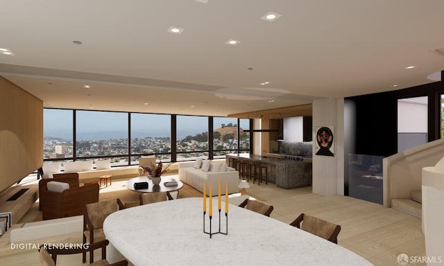 dining space with light hardwood / wood-style floors and a wall of windows