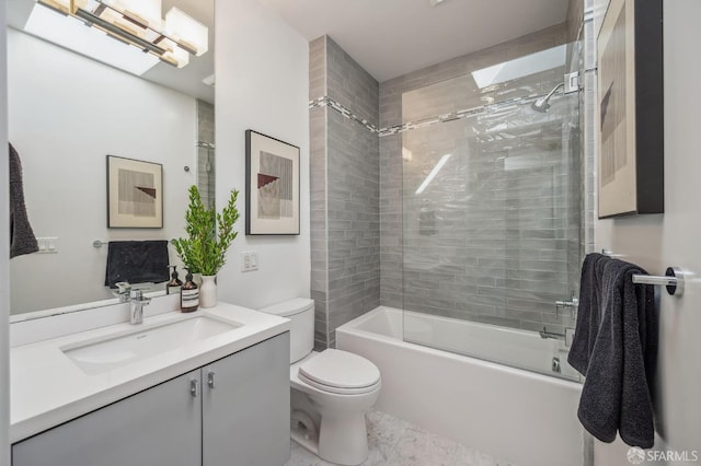 full bathroom with enclosed tub / shower combo, vanity, and toilet