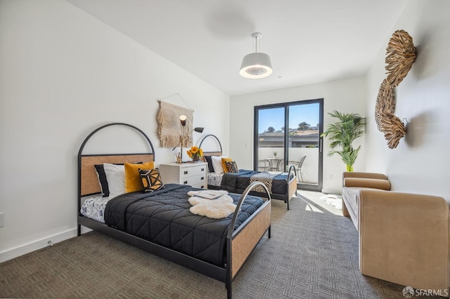 bedroom featuring dark carpet and access to outside