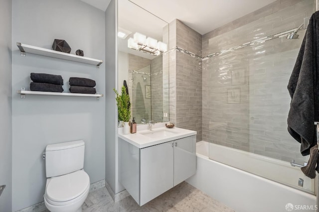 full bathroom with vanity, toilet, and tiled shower / bath combo