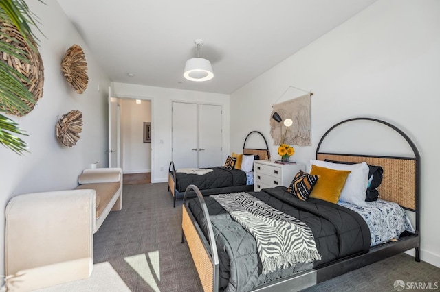 carpeted bedroom with a closet