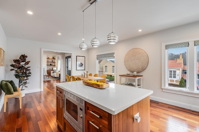 20 Marietta Dr, San Francisco, CA 94127 - kitchen featuring stainless steel microwave, light wood-style flooring, baseboards, a kitchen island, and recessed lighting