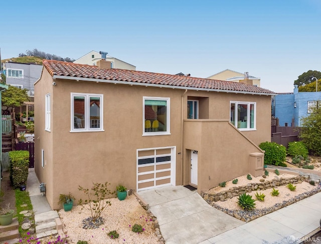 20 Marietta Dr, San Francisco, CA 94127 - view of front facade with a tile roof, stucco siding, a garage, a chimney, and driveway