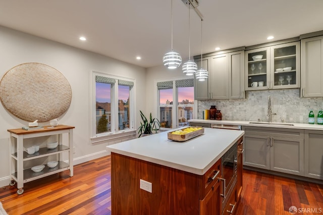 20 Marietta Dr, San Francisco, CA 94127 - kitchen featuring gray cabinetry, a sink, light countertops, stainless steel microwave, and dark wood-style flooring