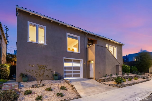 20 Marietta Dr, San Francisco, CA 94127 - view of front of home featuring stucco siding, concrete driveway, and a garage